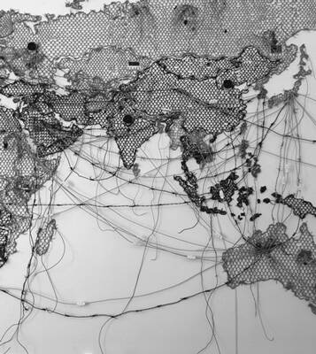 Centered on the Indian Ocean a map made of netting with India and central Asia to the north, Africa to the west, Indonesia and Australia to the East; wires show lanes of travel across the ocean with many heading to the Suez Canal in the west from the eastern regions.